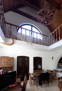 a room with a table and chairs and a ceiling at Edelmann Panzió in Balatonakali