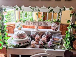 a table with a cake and some candy on it at Crown & Anchor Inn in Brough