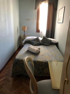 Postel nebo postele na pokoji v ubytování Alloggi Santa Sofia