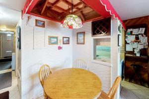 a dining room with a wooden table and chairs at Sea Time 407S in Ocean City