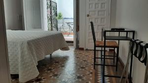 Posteľ alebo postele v izbe v ubytovaní Casa Consell Bailen, Guest House