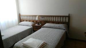 Łóżko lub łóżka w pokoju w obiekcie Disan 3A