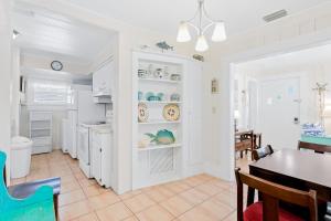 A kitchen or kitchenette at The Seashell Cottage
