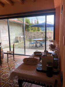 a dining room with a table and a view of a patio at LOCAZIONE TURISTICA IL BRICCHETTO in Parodi Ligure +29 photos