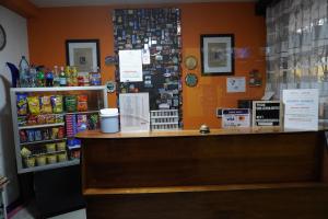 a shop with a counter and a cash register at Hostal Guatefriends in Guatemala