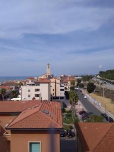 a view of a city with a street and buildings at Costa degli Etruschi in San Vincenzo