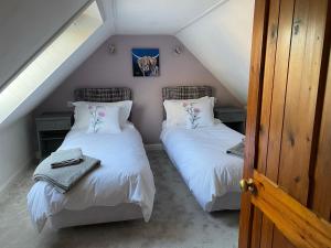 Voodi või voodid majutusasutuse Monawilline Cottage toas