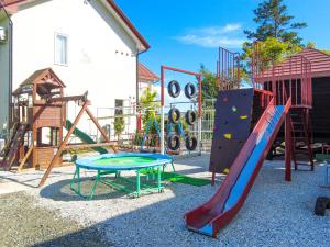 a playground with a slide and a slide at Petit Hotel Blaneneige in Nakafurano