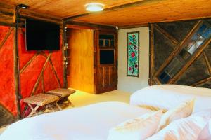 Un pat sau paturi într-o cameră la Loft de montaña El Quillay
