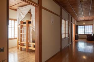 Postel nebo postele na pokoji v ubytování Guest House Takazuri-KITA