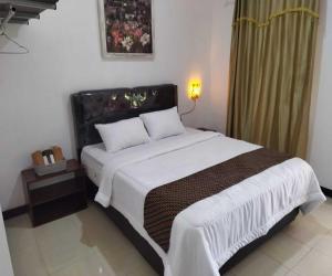 Ein Bett oder Betten in einem Zimmer der Unterkunft Borobudur Cluster Homestay Candirejo Syariah