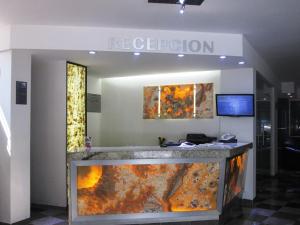 a lobby with a large aquarium in the middle at Hotel Premier in Mexico City