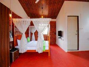 Postel nebo postele na pokoji v ubytování Treebo The Appa'S Resort