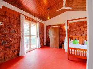 Postel nebo postele na pokoji v ubytování Treebo The Appa'S Resort