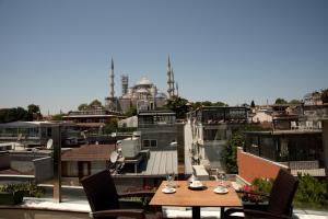 a large building with a clock on top of it at Ferman Hotel Old City -Special Category in Istanbul