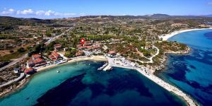 an aerial view of a small island in the ocean at Hotel Alexandros in Ormos Panagias
