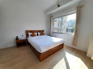 Postel nebo postele na pokoji v ubytování Eco Inn Guest House