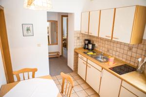 a kitchen with a sink and a counter top at Schloss Fürstenstein in Berchtesgaden