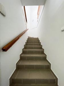 a staircase in a building with a window at Villa Klapka in Zamárdi