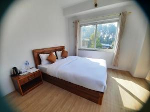 Postel nebo postele na pokoji v ubytování Eco Inn Guest House