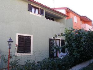 a house with a street light in front of it at Apartment Anni in Pula