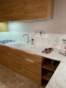 a kitchen with a sink and a counter top at Team Holiday - Camping du Petit Pont in Arvert