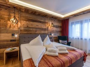 Voodi või voodid majutusasutuse Tennenwirt Hotel toas
