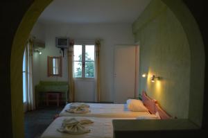 Posteľ alebo postele v izbe v ubytovaní Villas Georgy