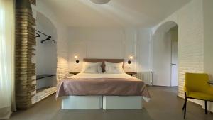 Postel nebo postele na pokoji v ubytování EL ZAGUÁN DE LA JUDERÍA