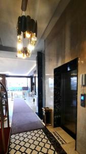 TV a/nebo společenská místnost v ubytování جولدن نيو جوان - Golden New Gewan Hotel