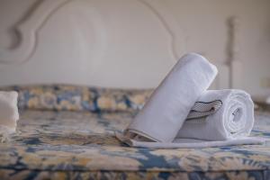 A bed or beds in a room at Il Giardino degli Oleandri
