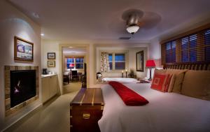 a bedroom with a large bed and a fireplace at 1906 Lodge in San Diego +85 photos