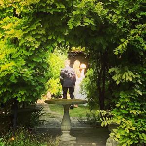 a bride and groom standing in a garden at Hotel Sant'Antonin in Venice