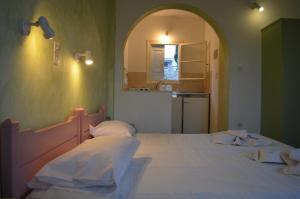 Posteľ alebo postele v izbe v ubytovaní Villas Georgy