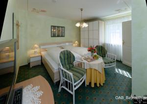 Postel nebo postele na pokoji v ubytování Hotel Garni Regina