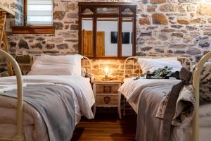 Posteľ alebo postele v izbe v ubytovaní Helene Eco Luxury Villa
