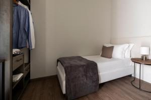 Postel nebo postele na pokoji v ubytování Civico25 Suite Hotel