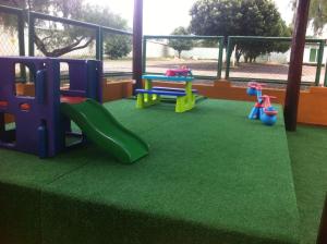 a play area with a playground with a slide at Thermas Place in Caldas Novas +13 photos