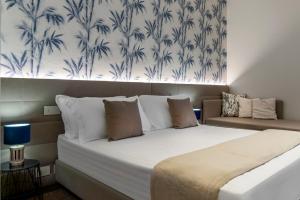Postel nebo postele na pokoji v ubytování Civico25 Suite Hotel