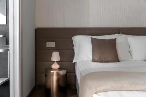 Postel nebo postele na pokoji v ubytování Civico25 Suite Hotel