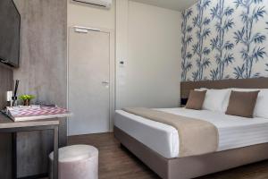 Postel nebo postele na pokoji v ubytování Civico25 Suite Hotel
