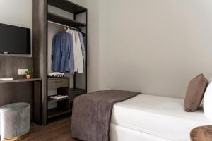 Postel nebo postele na pokoji v ubytování Civico25 Suite Hotel