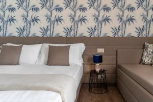 Postel nebo postele na pokoji v ubytování Civico25 Suite Hotel
