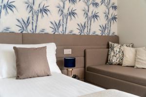 Postel nebo postele na pokoji v ubytování Civico25 Suite Hotel