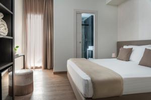 Postel nebo postele na pokoji v ubytování Civico25 Suite Hotel