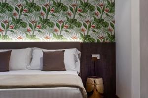 Postel nebo postele na pokoji v ubytování Civico25 Suite Hotel