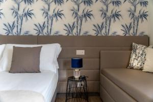 Postel nebo postele na pokoji v ubytování Civico25 Suite Hotel