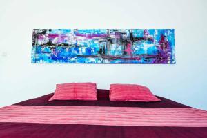 Ein Bett oder Betten in einem Zimmer der Unterkunft Rapture Surfcamps Green Bowl