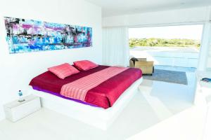 Ein Bett oder Betten in einem Zimmer der Unterkunft Rapture Surfcamps Green Bowl