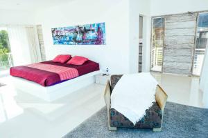 Ein Bett oder Betten in einem Zimmer der Unterkunft Rapture Surfcamps Green Bowl